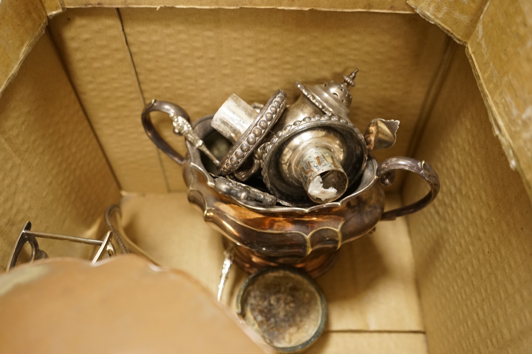 A quantity of assorted plated wares, including flatware, a tea caddy, a chatelaine, a toast rack, a sauceboat, a butter dish and a pair of candlesticks, etc.